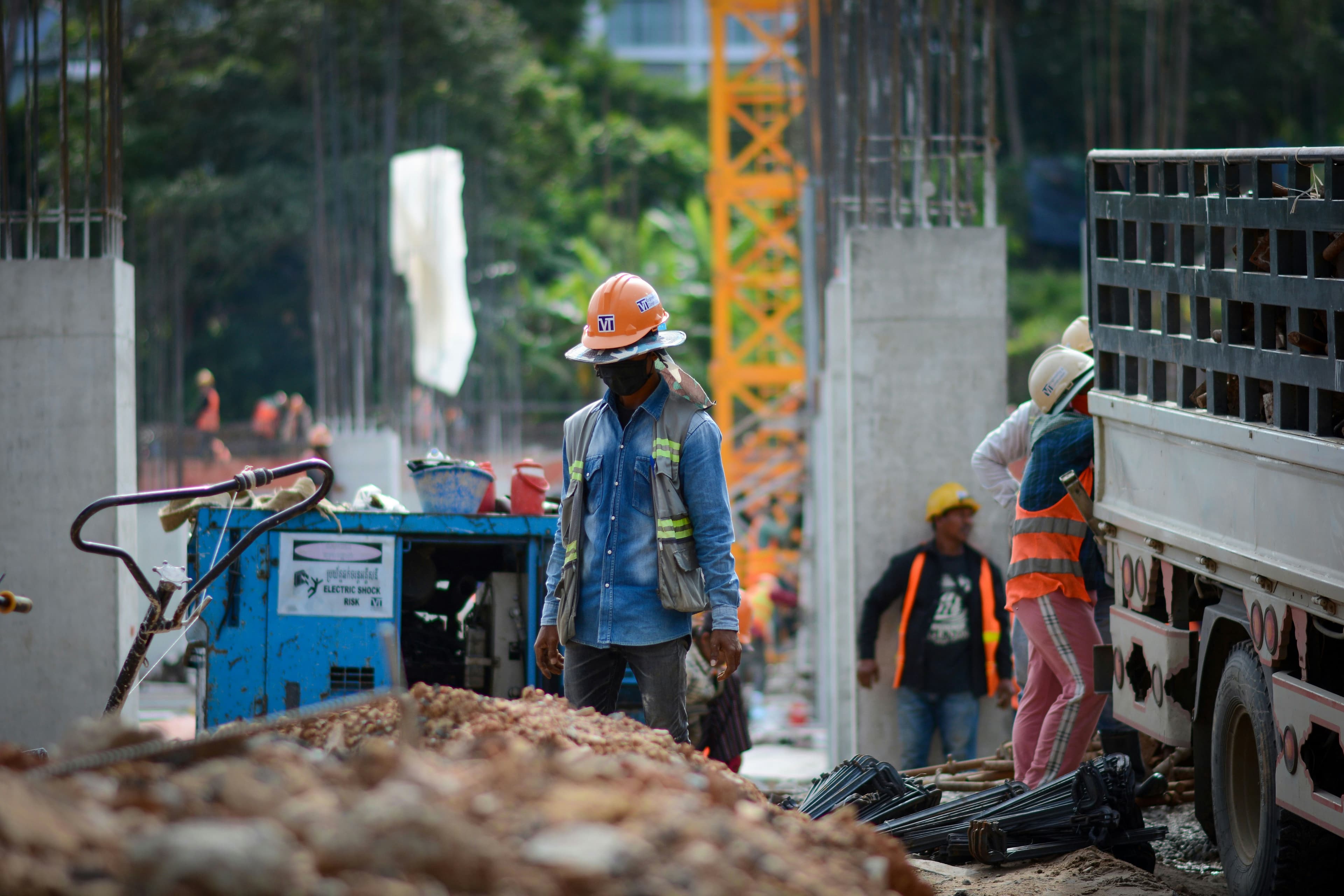 Site engineer supervising activity on a construction project
